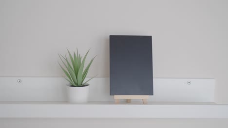 blackboard display on a white shelf