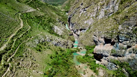 drone shot reveal of milpo ayacucho turquooise ponds