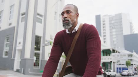 African-American-man-biking-in-the-street-