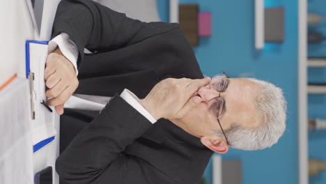 vertical video of home office worker man nervously waiting at laptop.