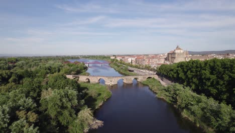 Drone-flight-up-Tagus-river-showing-bridges-and-city-of-Talavera-de-la-Reina