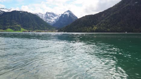 beautiful view of lake with mountains behind it