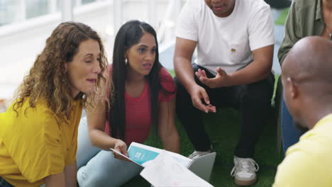 diverse group in a meeting discussing design ideas