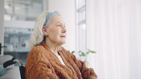 Old-woman,-thinking-and-sad-with-window