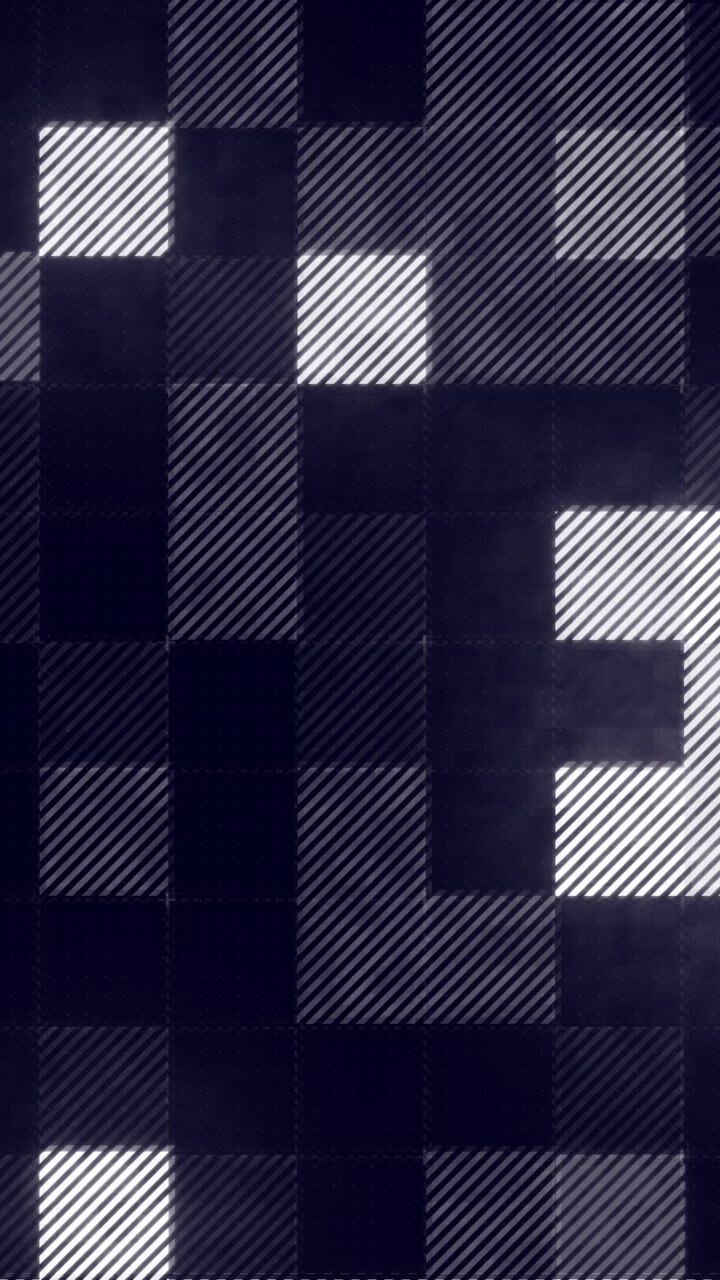 Vertical video: LED grid starting with few lit tiles, shifting and pulsing to show scrolling mosaic