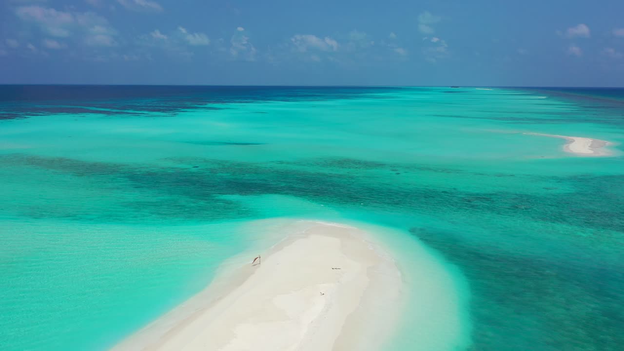 white sand beach, sandbar in tropical Seychelles, on high tide, beautiful crystal clear waters