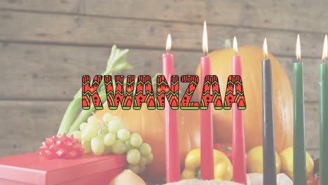 animación del texto kwanzaa sobre velas kwanzaa y calabazas