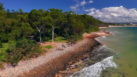 greenery landscape and rocky shore at noosa national park near noosa heads in queensland, australia