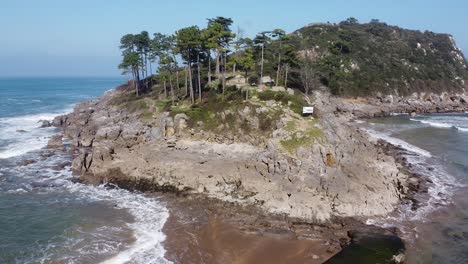 drone aerial view of the san nicolás island at the beach of lekeitio in the basque country