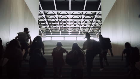 teenage students running upstairs in school corridor. crowd pupils leave campus.