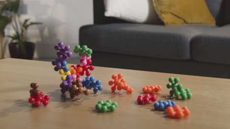 coloured interlocking shape puzzle on table at home for child diagnosed with asd 1