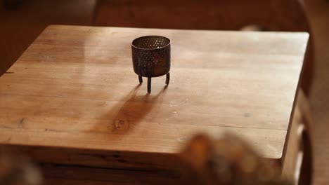 rustic wooden table with unique metal candle holder home decor