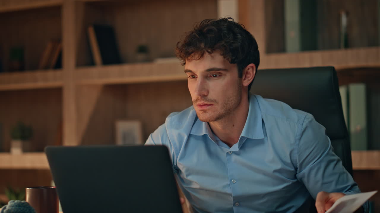 Financial manager rejoicing success working late workplace close up. Man dancing