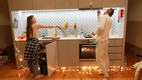 young couple cooking in a cozy apartment kitchen