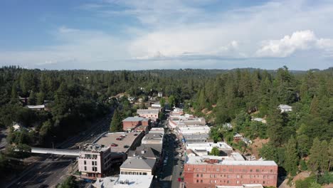 wide reverse pullback aerial shot of the historical mining town placerville