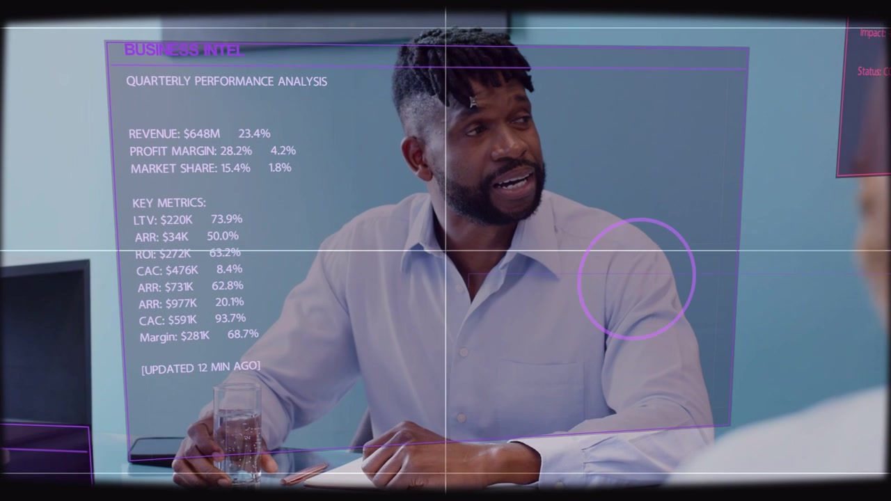 Manager sitting at table holo UI appearing pointing at purple chart reviewing Qtr business metrics