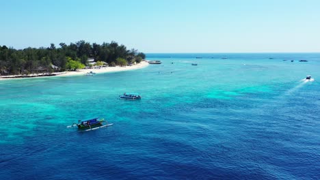 Boats-Moored-at-paradise-tropical-Island-with-azure-turquoise-sea-in-the-Philippines