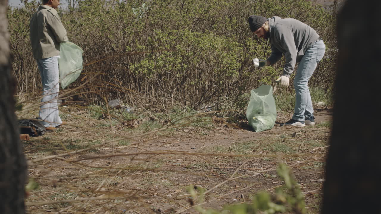Black Girl Collecting Plastic Waste in Forest