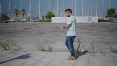 man walking in city parking lot