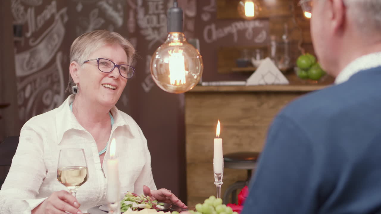 Older couple enjoying dinner at a restaurant