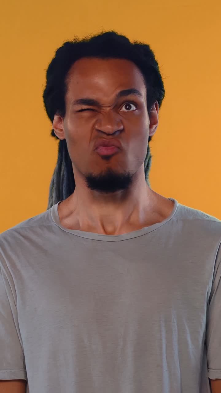 Young Man Making Funny and Expressive Facial Expressions