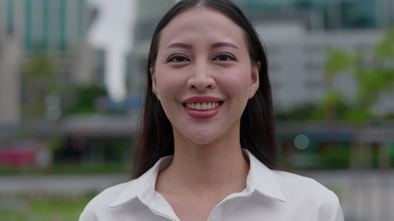 Portrait of Smiling Asian Businesswoman in Urban Setting