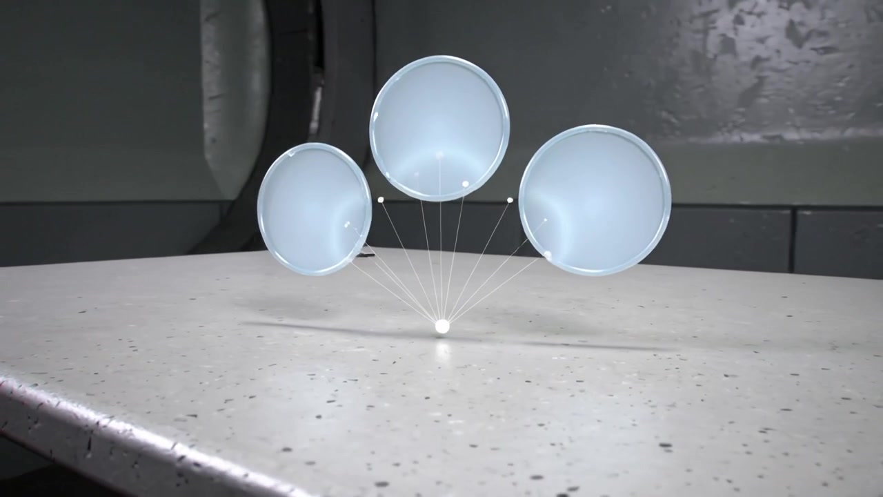 Falling blue sphere forming three cups, settling on lab bench, demonstrating threads and white bead