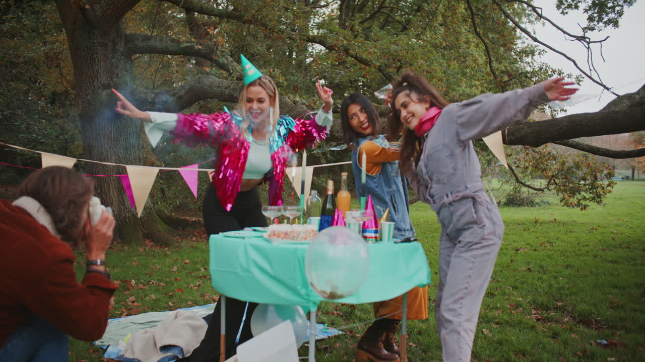 Friends Celebrating a Birthday in a Park