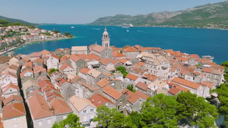 gentle aerial shot circling around the town of korcula, croatia on a bright day