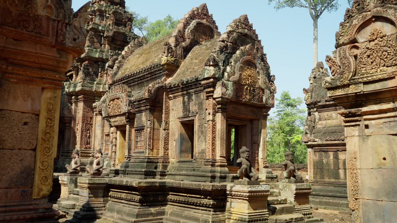 Wide shot of spetactular ancient stone temple with intricate carvings at Banteay Srei, near Angkor Wat, Cambodia