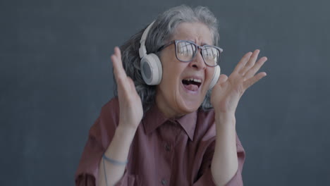 happy senior woman listening to music