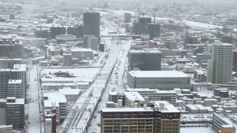 beautiful view out on sapporo city from above, covered in snow