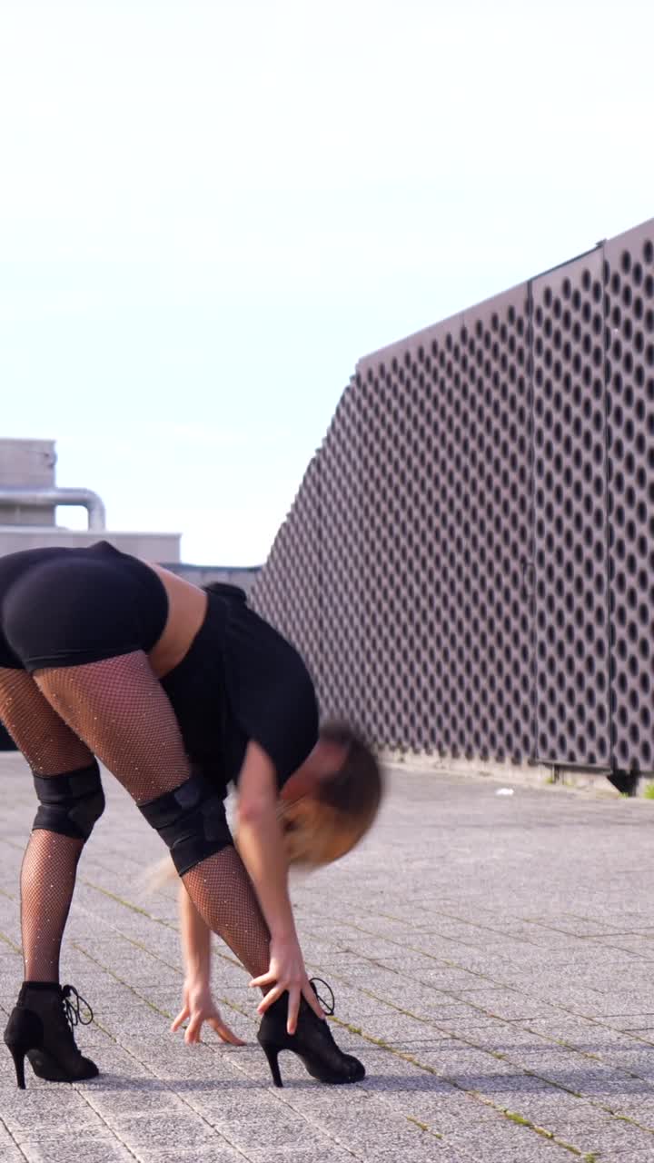 Blonde Woman Dancing in Urban Setting