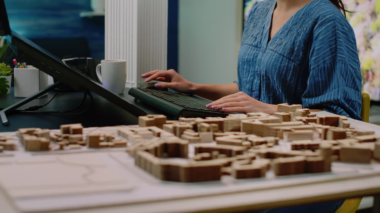 Close up of architectural desk with building model