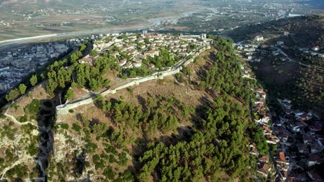 Aerial-of-Berat-castle-in-Albania,-the-medieval-fortress-is-on-a-rock