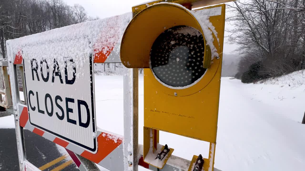 blinking caution light, blue ridge parkway baracade showing road closed due to winter weather