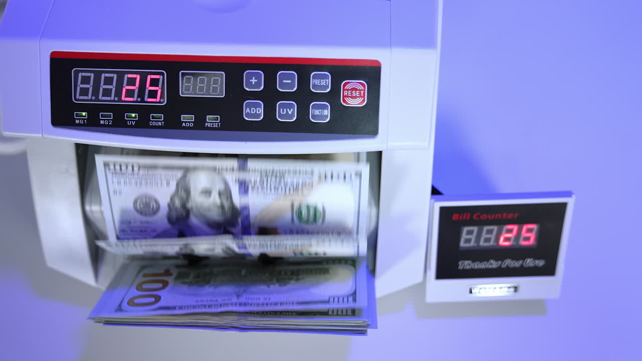 Money counting equipment for paper money calculation. Automatic mechanism for bank financial operations.