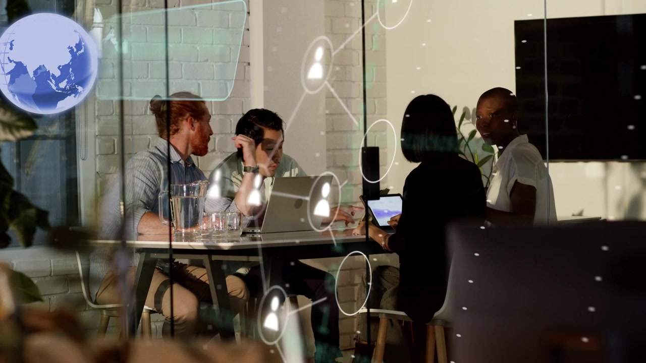 Center laptop user typing, team tapping tablet and viewing tech data, HUD panes appearing on glass