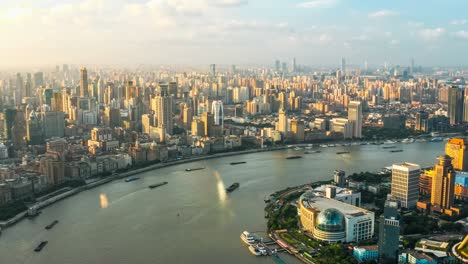 aerial view of river and city skyline in shanghai