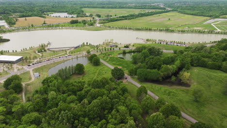 shelby farms park in memphis with lush greenery and lake, on an overcast day, aerial view