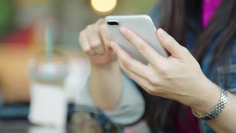 close up female hands holding smartphone using mobile application,concept of using technology in daily life online shopping online payment