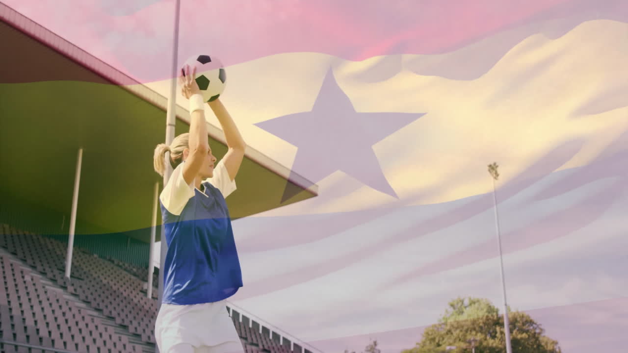 Preparing throw-in, soccer player in stadium with Ghana flag in background