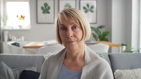 video portrait of senior woman sitting at home