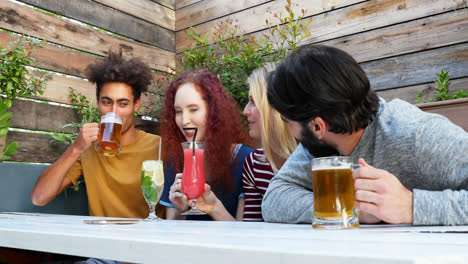 friends interacting while having drink 4k