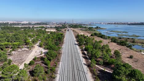 Drone-shot-from-a-train-waggon-parking-in-Seixal,-Portugal