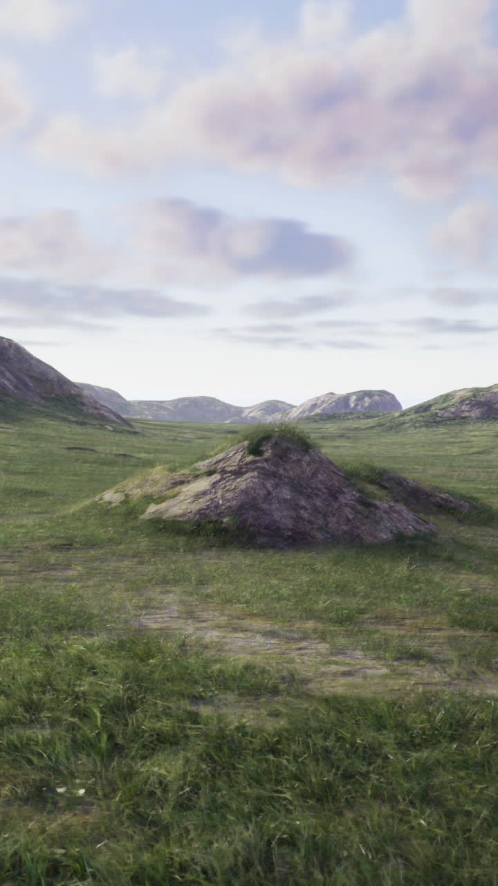 Dramatic landscape with rolling hills and grassy plain under a cloudy sky