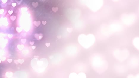 Animation-of-falling-glowing-pink-hearts-over-bright-background