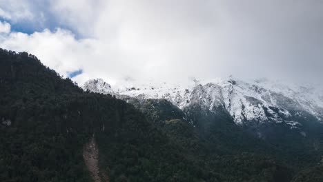 Hyperalpse-of-snowy-and-cloudy-mountains-in-Hornopiren-National-Park,-Hualaihue,-Chile