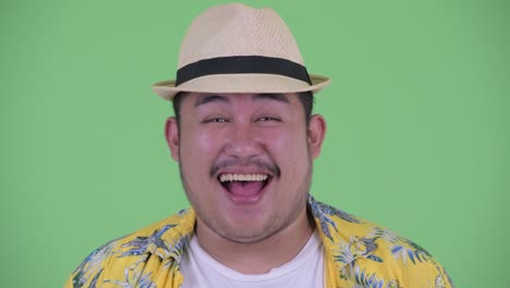 young handsome overweight asian tourist man