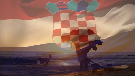 Animation-of-flag-of-croatia-over-caucasian-man-with-dogs-at-beach